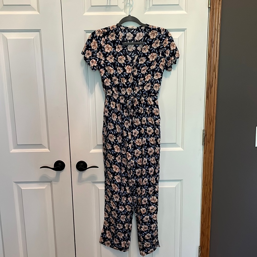 Short sleeve floral jumpsuit with snap front closure